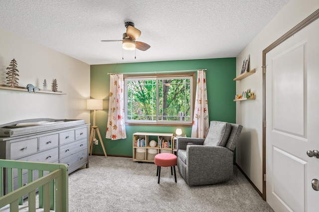 2895 Thunder Bay Ct, Little Canada, MN 55117 - carpeted bedroom featuring a crib, a textured ceiling, ceiling fan, and baseboards