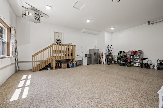 2895 Thunder Bay Ct, Little Canada, MN 55117 - garage with stainless steel refrigerator with ice dispenser, a heating unit, and a sink