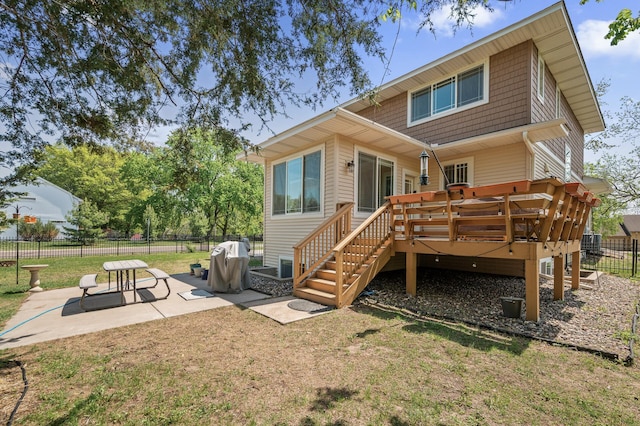 2895 Thunder Bay Ct, Little Canada, MN 55117 - rear view of house featuring a patio, a wooden deck, and stairway