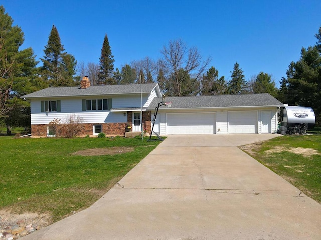 view of front of property with brick siding, driveway, a garage, a front yard, and a chimney