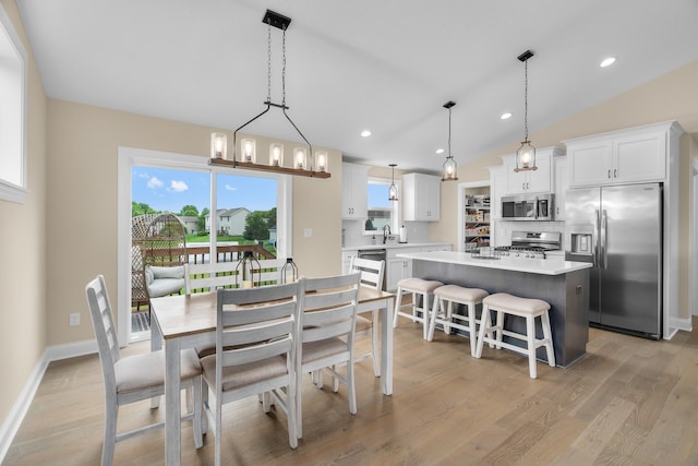 1581 Philipp Way, Shakopee, MN 55379 - dining area featuring light wood-style floors, lofted ceiling, and recessed lighting