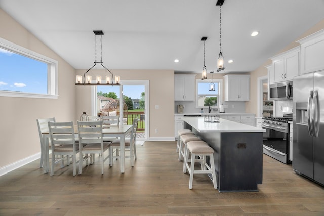 1581 Philipp Way, Shakopee, MN 55379 - kitchen with stainless steel appliances, a center island, a chandelier, dark wood-type flooring, and recessed lighting
