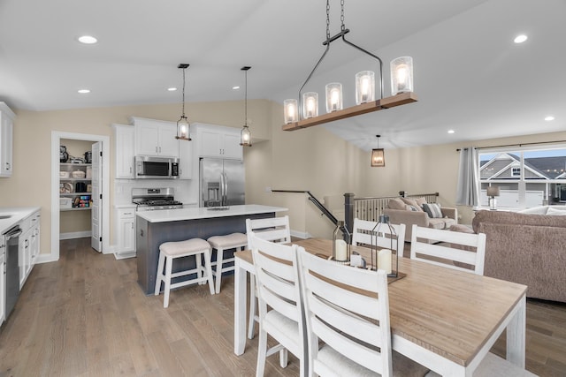 1581 Philipp Way, Shakopee, MN 55379 - dining room with vaulted ceiling, light wood-type flooring, and recessed lighting