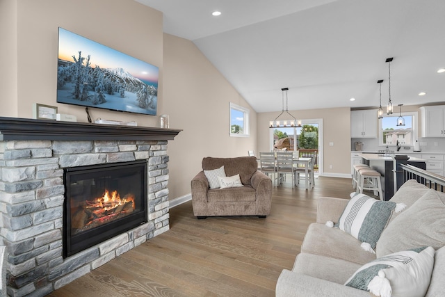 1581 Philipp Way, Shakopee, MN 55379 - living room with vaulted ceiling, wood finished floors, recessed lighting, and a fireplace