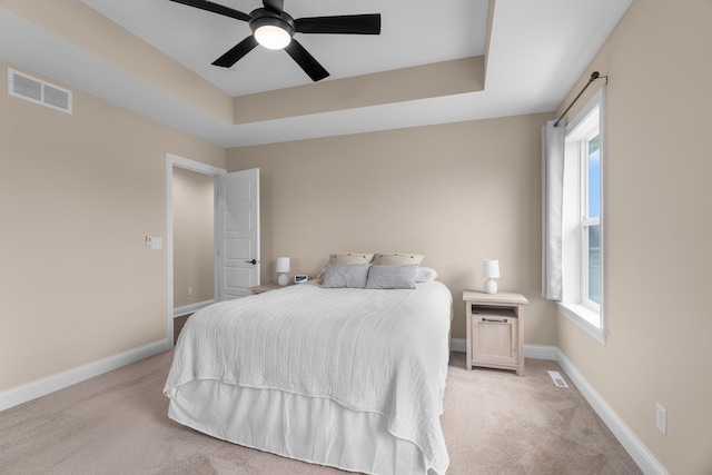 1581 Philipp Way, Shakopee, MN 55379 - bedroom featuring light carpet, a raised ceiling, and ceiling fan