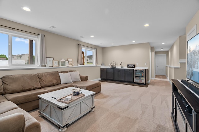 1581 Philipp Way, Shakopee, MN 55379 - living area with bar with sink, recessed lighting, light carpet, and beverage cooler