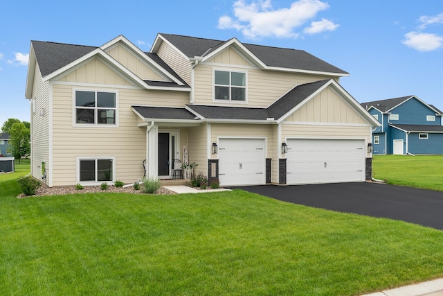 1581 Philipp Way, Shakopee, MN 55379 - view of front of house featuring board and batten siding, asphalt driveway, a front yard, and a shingled roof