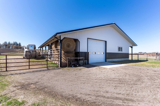 view of outbuilding with an outdoor structure, an exterior structure, and driveway