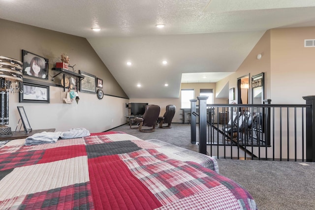 carpeted bedroom with visible vents and vaulted ceiling