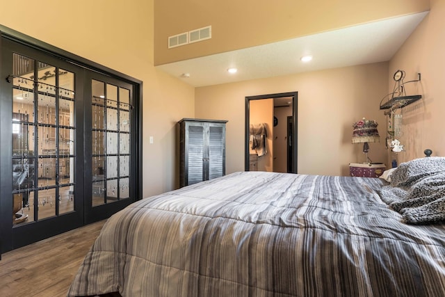 bedroom featuring recessed lighting, visible vents, and wood finished floors