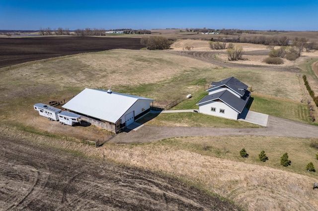birds eye view of property with a rural view