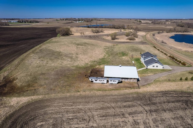 bird's eye view with a water view and a rural view