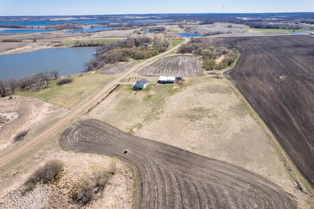 birds eye view of property with a water view and a rural view