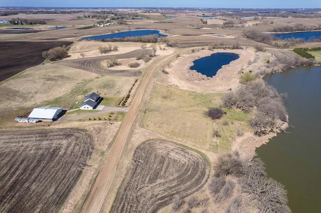 bird's eye view with a water view and a rural view