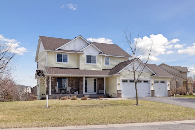 view of front facade featuring covered porch, an attached garage, driveway, a front yard, and a shingled roof