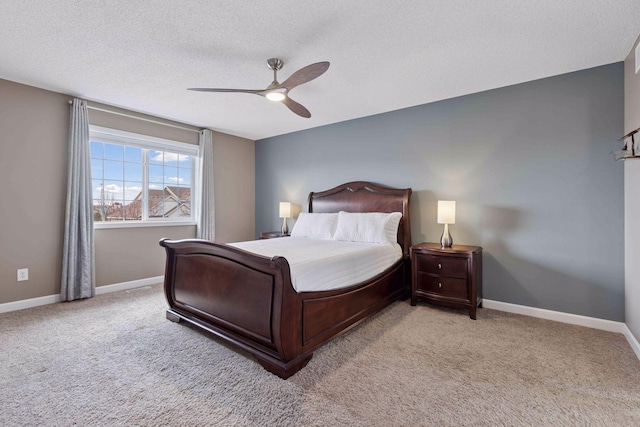 bedroom with light carpet, baseboards, and ceiling fan