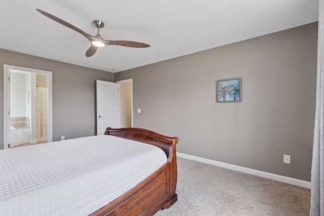 bedroom featuring ensuite bathroom, baseboards, a ceiling fan, and carpet floors