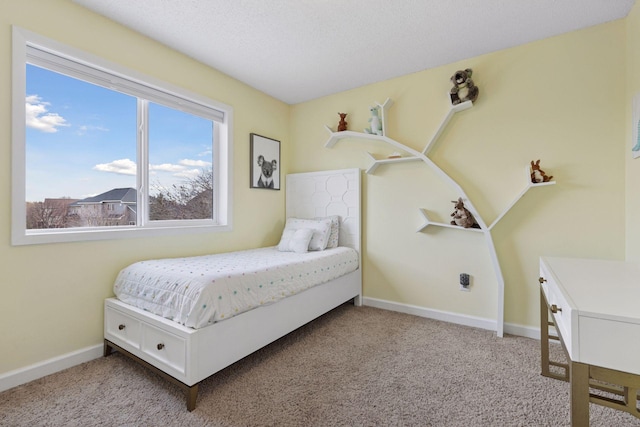 bedroom featuring carpet flooring and baseboards