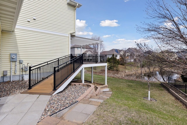 view of yard with a pergola, a deck, and a residential view