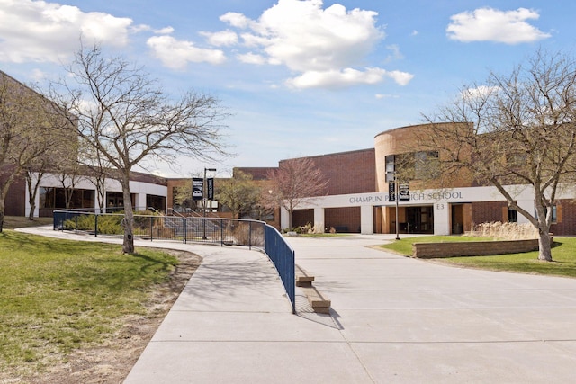 view of property's community with a lawn