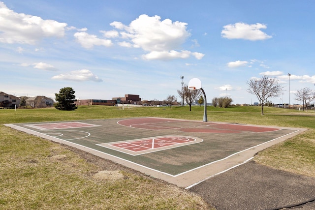 view of basketball court featuring a lawn and community basketball court