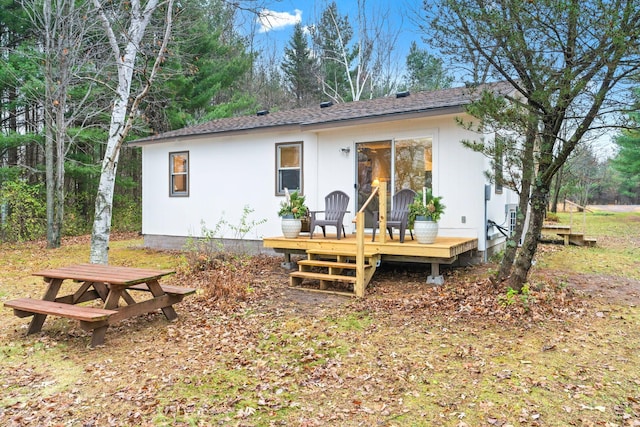 23245 County Rd W, Grantsburg, WI 54840 - rear view of property with a wooden deck