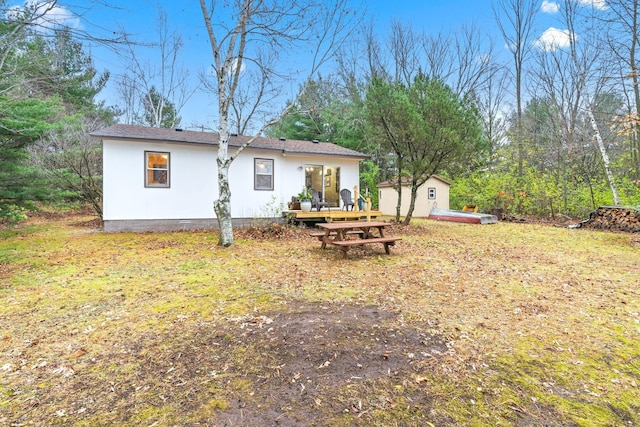 23245 County Rd W, Grantsburg, WI 54840 - view of yard featuring a deck, an outbuilding, and a shed