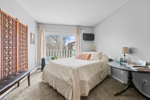 bedroom featuring carpet floors and a textured ceiling