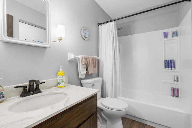full bathroom with vanity, toilet, wood finished floors, and shower / bath combo with shower curtain