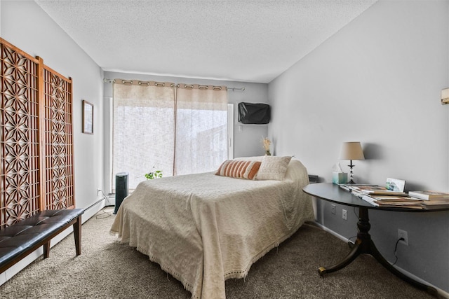 carpeted bedroom featuring a textured ceiling and baseboard heating