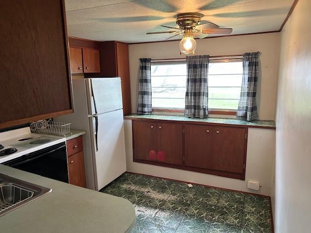 10010 Lake Rd, Watab Twp, MN 56367 - kitchen featuring white appliances, ceiling fan, and light countertops