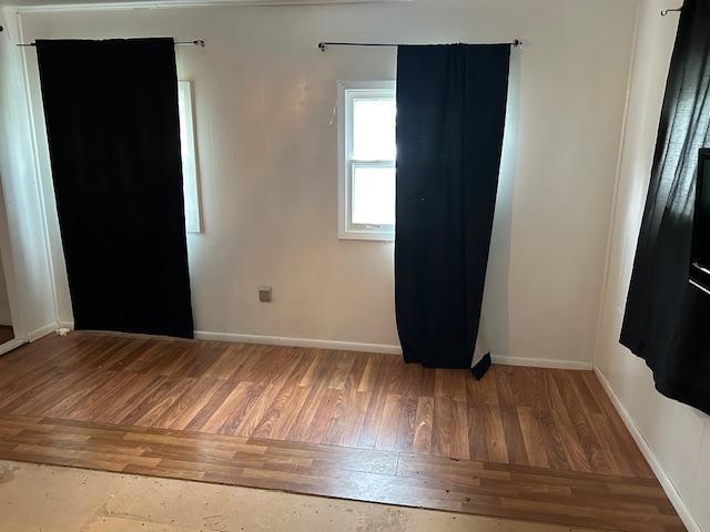 10010 Lake Rd, Watab Twp, MN 56367 - empty room featuring baseboards and wood finished floors
