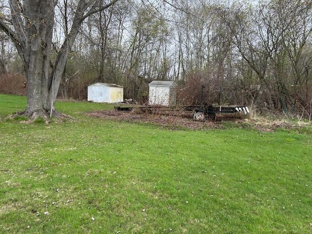10010 Lake Rd, Watab Twp, MN 56367 - view of yard featuring a storage shed and an outdoor structure