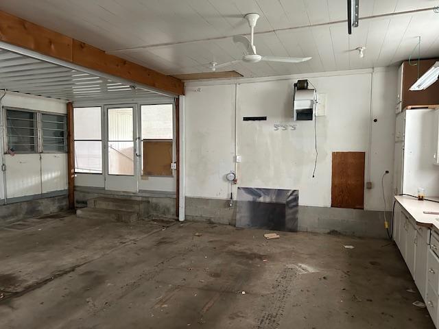 10010 Lake Rd, Watab Twp, MN 56367 - interior space featuring ceiling fan and unfinished concrete flooring
