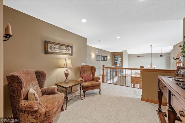 living area with carpet floors, a ceiling fan, baseboards, and recessed lighting