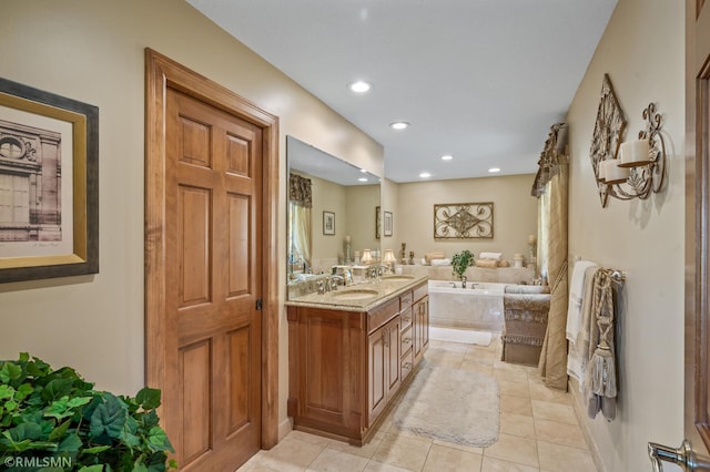 full bath with vanity, tile patterned floors, a garden tub, and recessed lighting