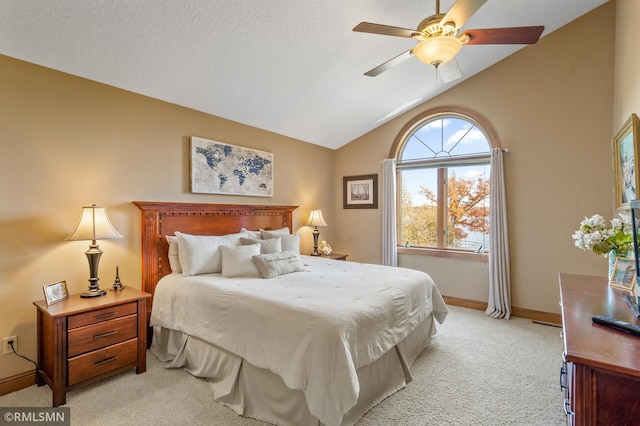 bedroom with baseboards, a ceiling fan, lofted ceiling, and light colored carpet
