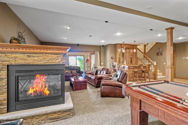interior space featuring carpet flooring, a stone fireplace, recessed lighting, decorative columns, and billiards