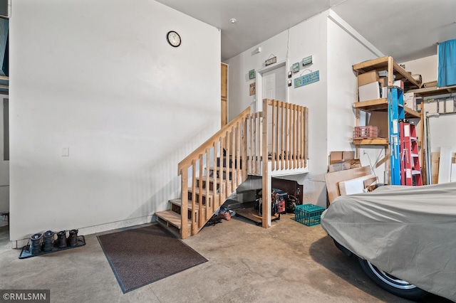 bedroom featuring concrete flooring