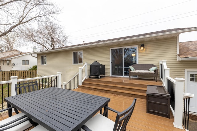 deck with fence and outdoor dining space