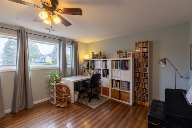 office area with ceiling fan, a textured ceiling, baseboards, wood finished floors, and visible vents