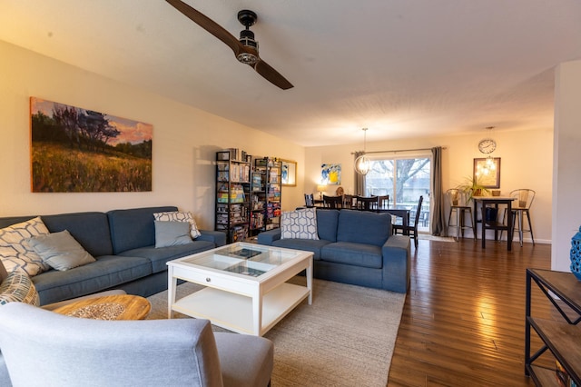living room with ceiling fan and hardwood / wood-style flooring