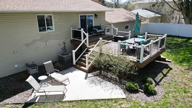 308 16th Ave SW, Austin, MN 55912 - rear view of house featuring a patio area, a shingled roof, a wooden deck, and fence