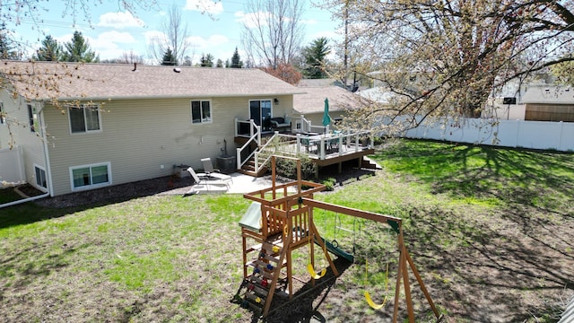 308 16th Ave SW, Austin, MN 55912 - back of house with a lawn, a deck, a patio, and fence