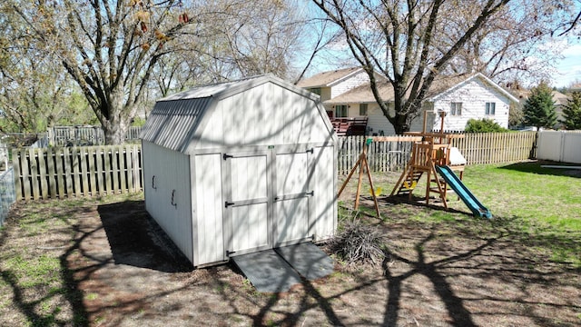 308 16th Ave SW, Austin, MN 55912 - view of shed with a fenced backyard and a playground