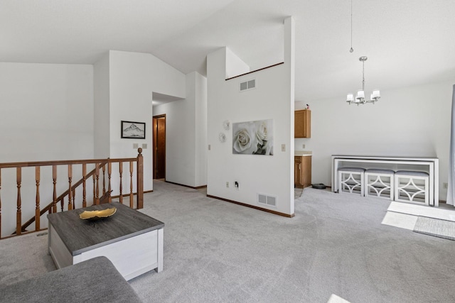 interior space featuring baseboards, a notable chandelier, light colored carpet, and visible vents