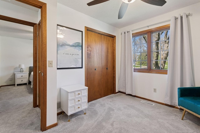 unfurnished bedroom featuring baseboards, visible vents, carpet, and a closet