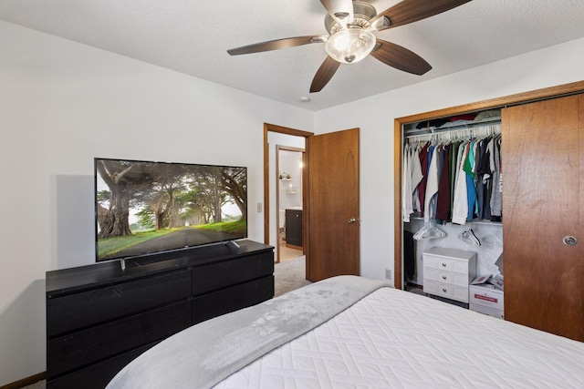 bedroom with a closet, a ceiling fan, and carpet