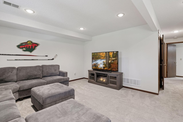 living area with light colored carpet, baseboards, and visible vents