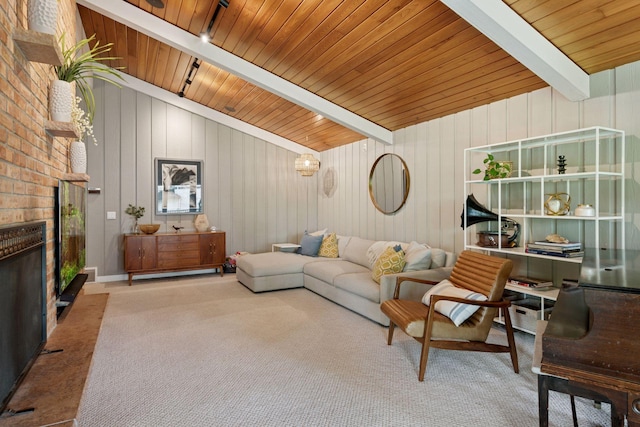 living room featuring carpet floors, a fireplace, and wooden ceiling